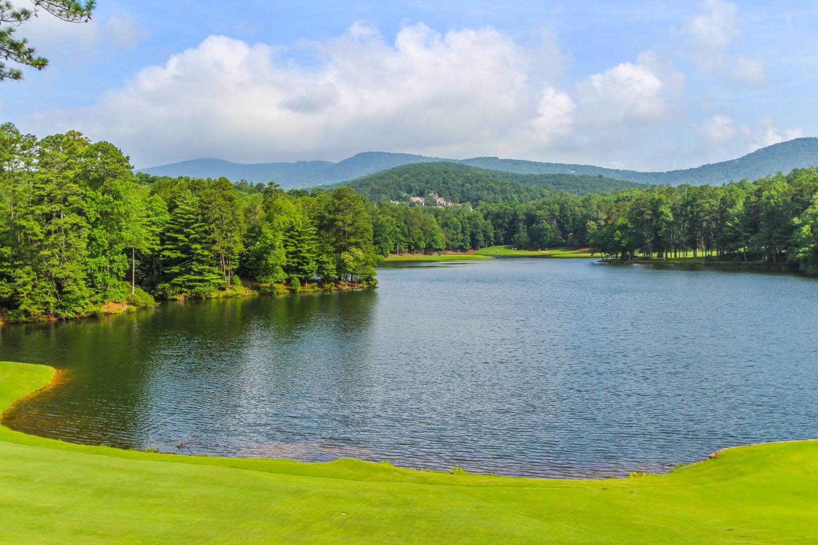 A peaceful lake view at VRI's Golf Club Villas in Marble Hill, Georgia.